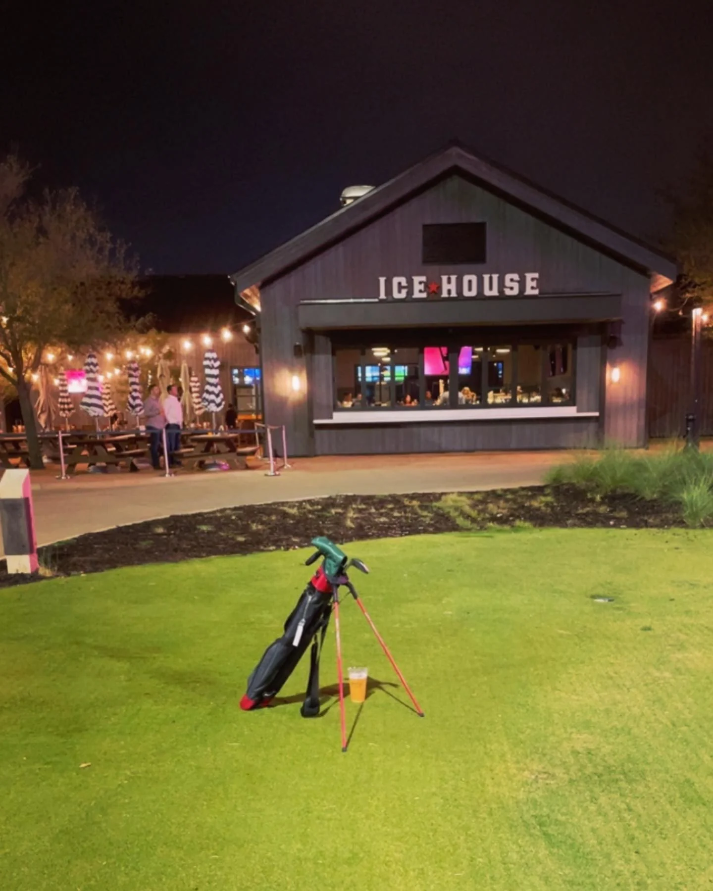 golf club sitting on golf green